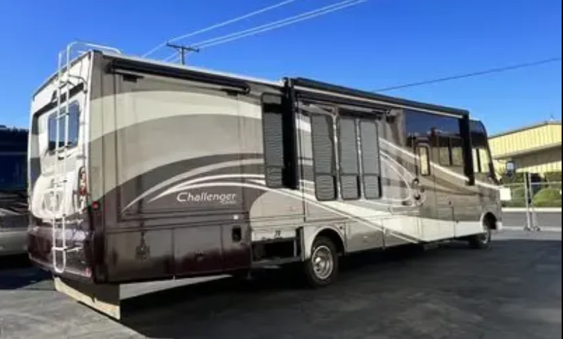 Repaired motorhome parked outdoors after exterior work