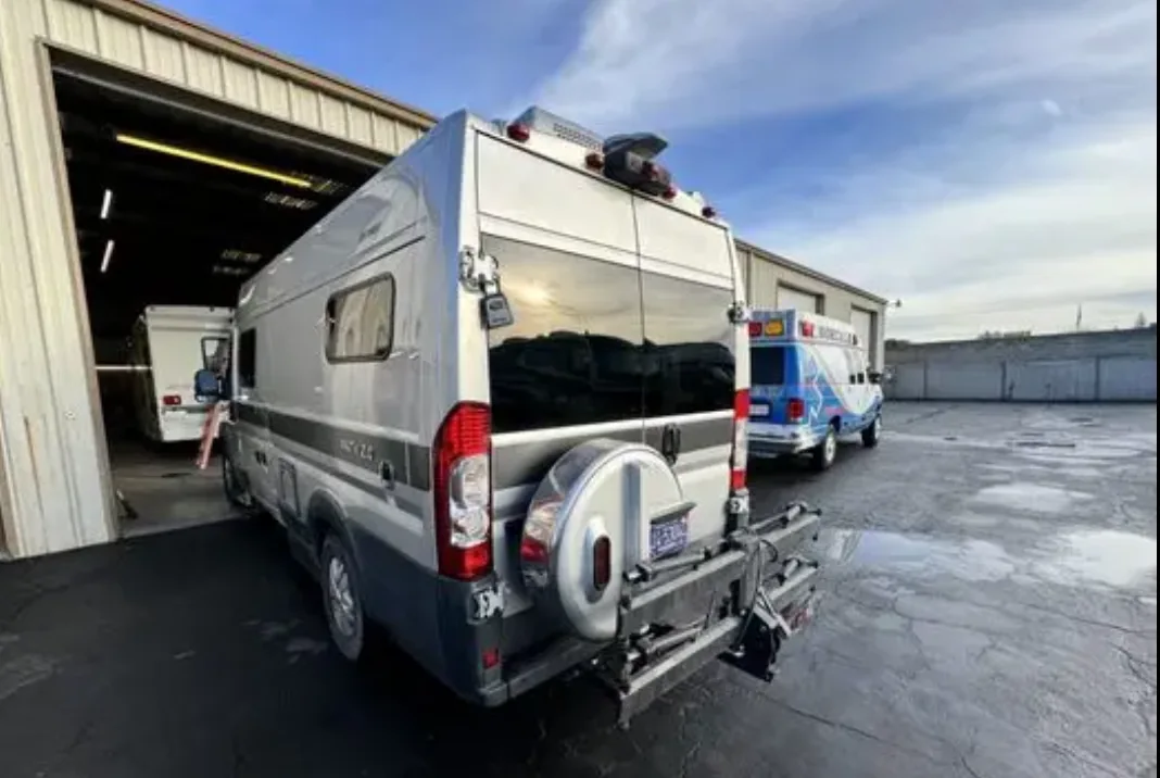 Camper van photographed outside the repair shop after refinishing work